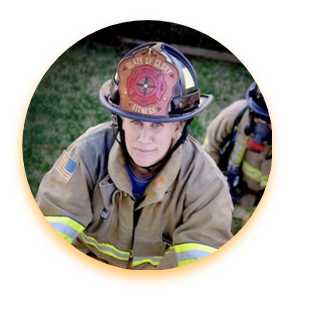 Shay Mountford climbing a ladder in her firefighter gear.