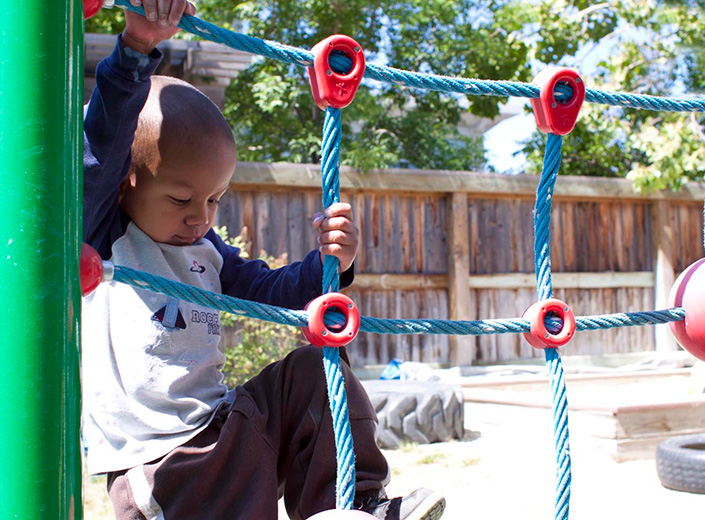 child playing on ropes