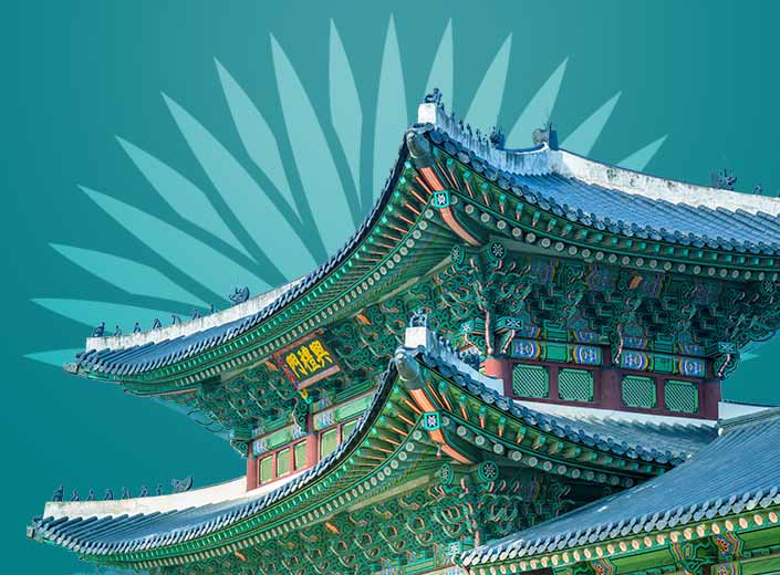 Japanese Temple, ornate against a blue sky.