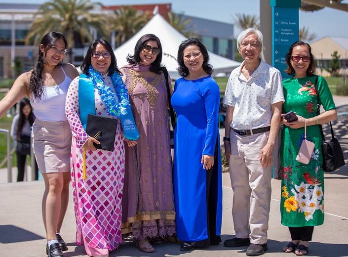 APIDA event with women in traditional Asian fashions.